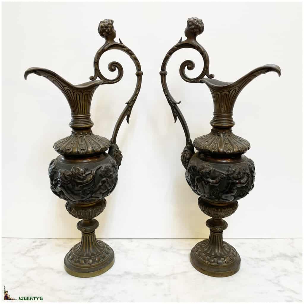 Pair of patinated bronze ewers with putti heads, belly decorated with a procession of cherubs, top. 43cm (End XIXe) 3
