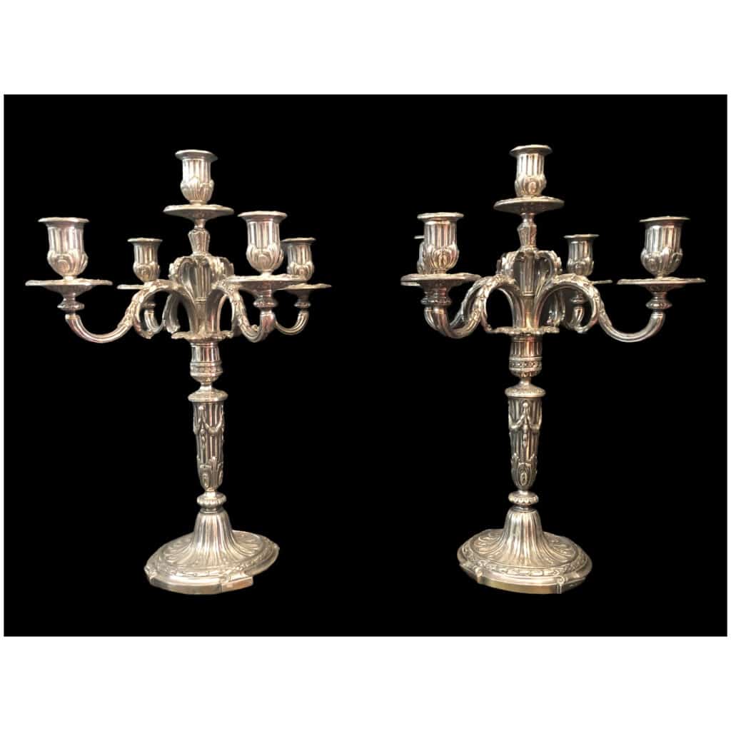 Pair of candelabra with five lights in chiseled and silvered bronze decorated with rudentée grooves, garlands, foliage. 8