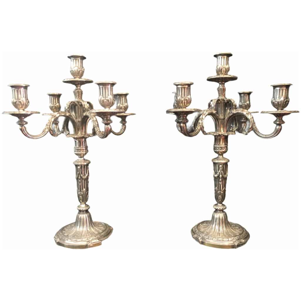 Pair of candelabra with five lights in chiseled and silvered bronze decorated with rudentée grooves, garlands, foliage. 7