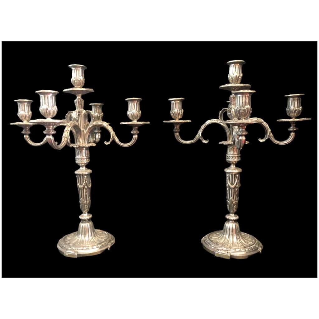 Pair of candelabra with five lights in chiseled and silvered bronze decorated with rudentée grooves, garlands, foliage. 3