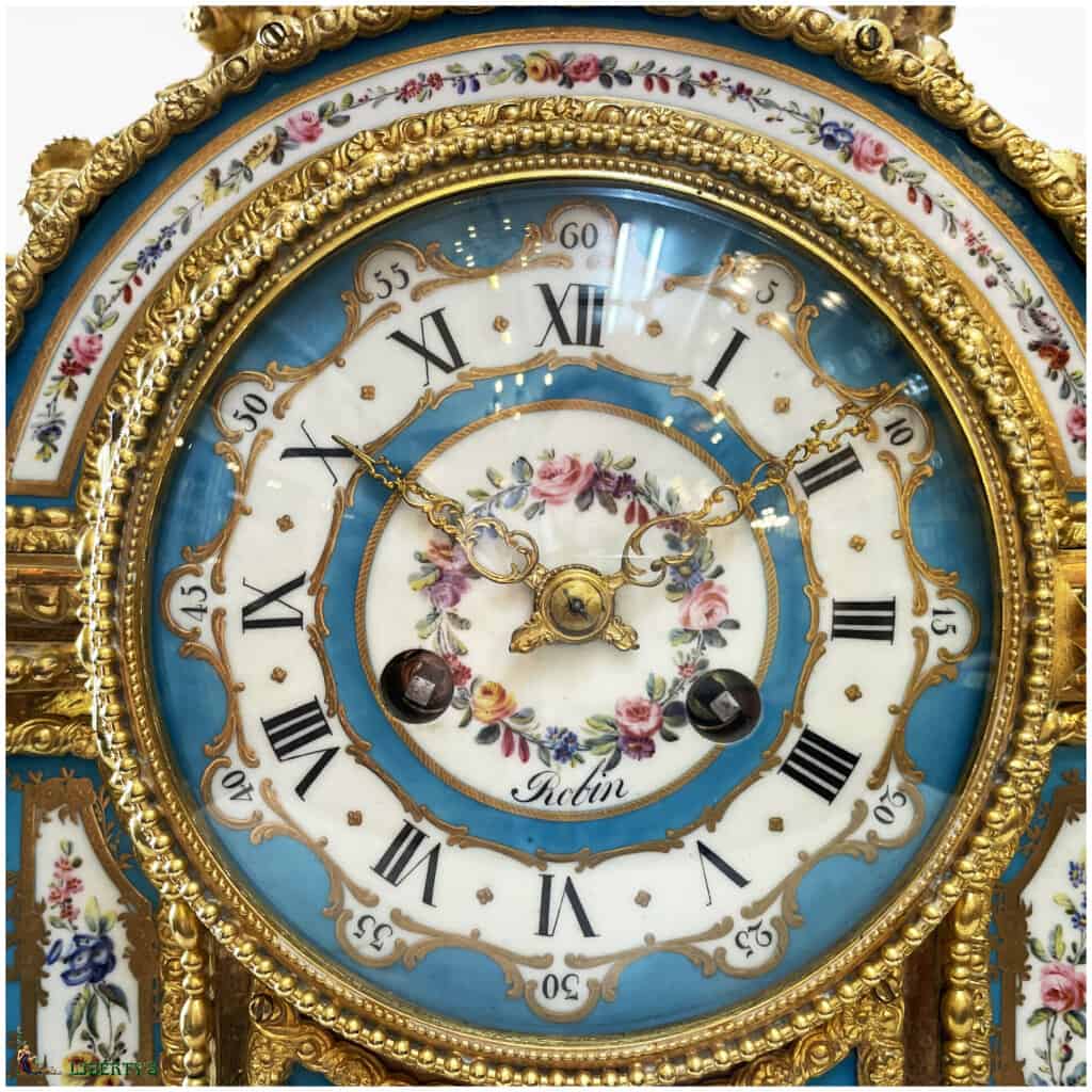 Mercury gilt bronze clock with 12 Sèvres porcelain plates, openwork hands, silk thread suspension, signed Robin à Paris, Haut. 47 cm, Mid. XIXe 4