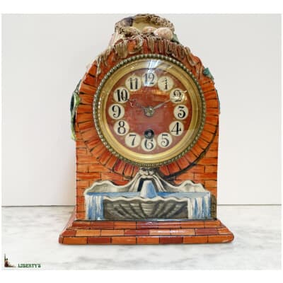 Slip clock with nest, 23 cm high (Fin XIXe)