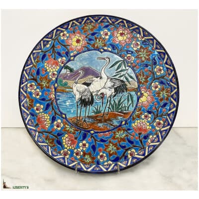 Dish with Emaux de Longwy cartel, decor of herons, diam. 31 cm, (1920-1930)