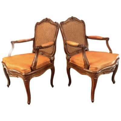 Paire de fauteuils d’époque Régence en bois naturel estampillés Jean Avisse