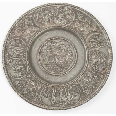 Paten with relief decoration.