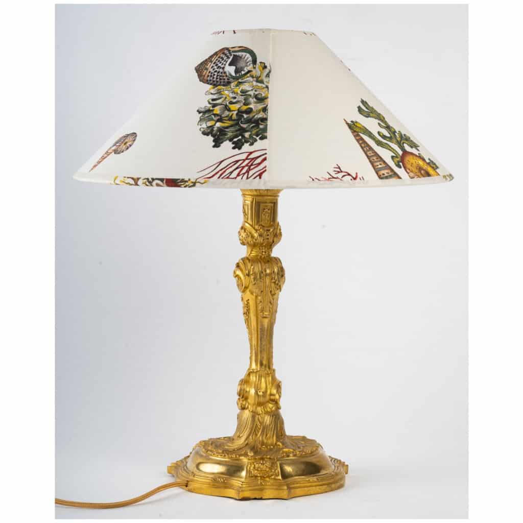 Armorial gilt bronze lamp. 5