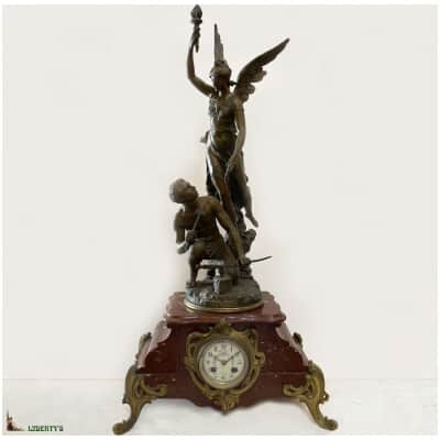 Art-Nouveau pendulum clock on grilled marble base “Glory at work”, signed Ch. Vély, top. 78cm, (End XIXe)