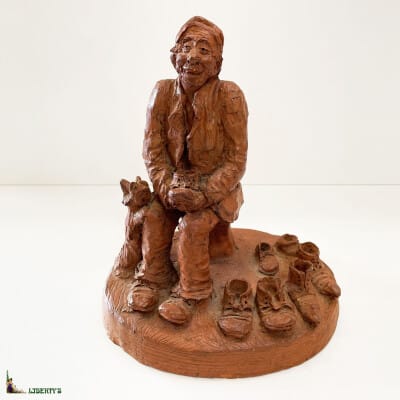 Terracotta subject "Old man with shoes", signed Louis Falks, larg. 19 cm (Deb. XXth)