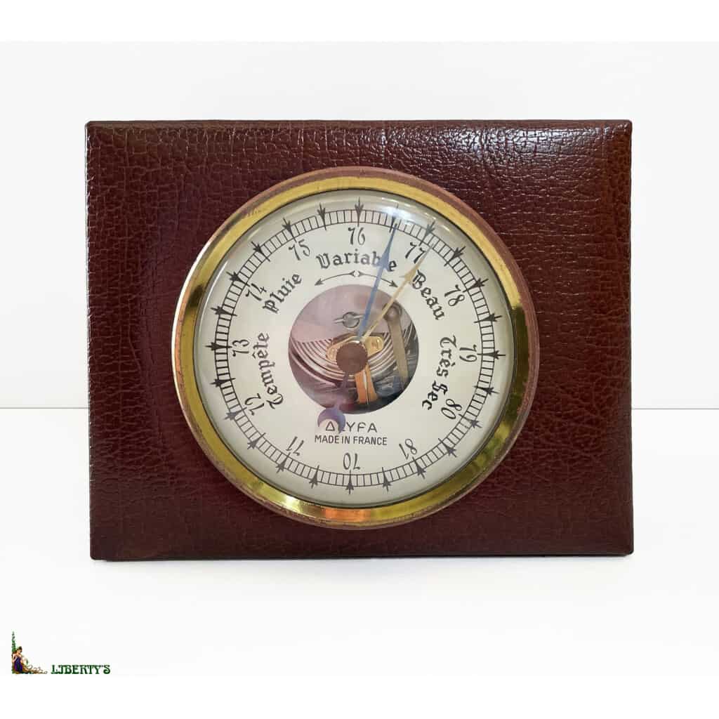 Lyfa France aneroid barometer on leather signed Le Tanneur, width. 11 cm, (Late 3th century) XNUMX