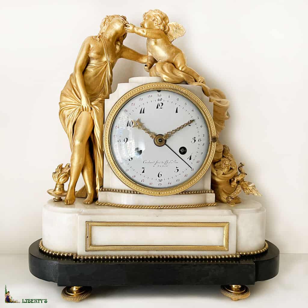 Pendule Louis XVI bronze doré au mercure et marbre noir et blanc Eros et Cupidon signée Cachard succ. de Charles Leroy à Paris, mouvement avec quantième, suspension à fil de soie, aiguilles ajourées, haut. 34.5 cm, (Fin XVIIIe) 3