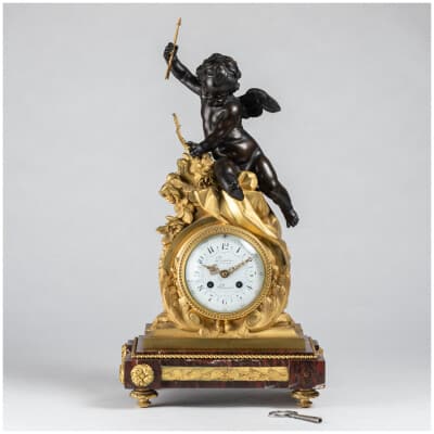 Guillaume Denière (1815-1901), Cupid clock in bronze with brown patina and gilded bronze, XNUMXth century