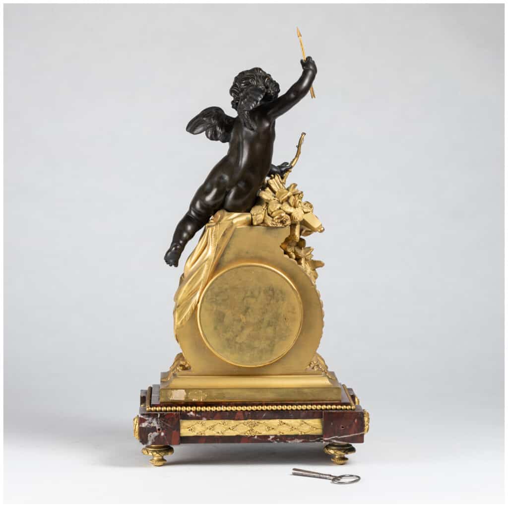 Guillaume Denière (1815-1901), Cupid clock in bronze with brown patina and gilt bronze, 6th century XNUMX