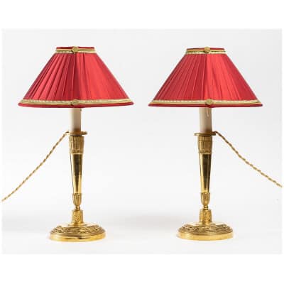 Empire Period Pair of candlesticks mounted as lamps in chiseled and gilded bronze with quiver decoration