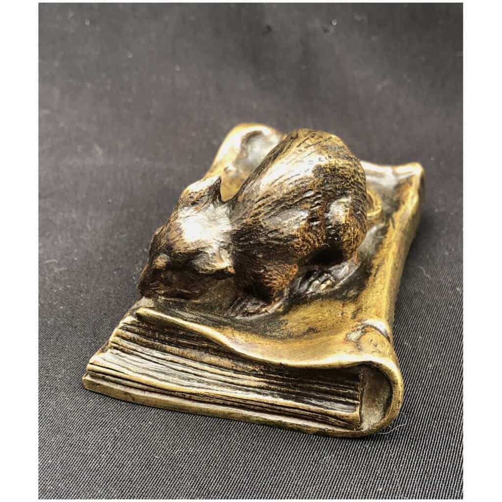 Bronze mouse munching on a book 4