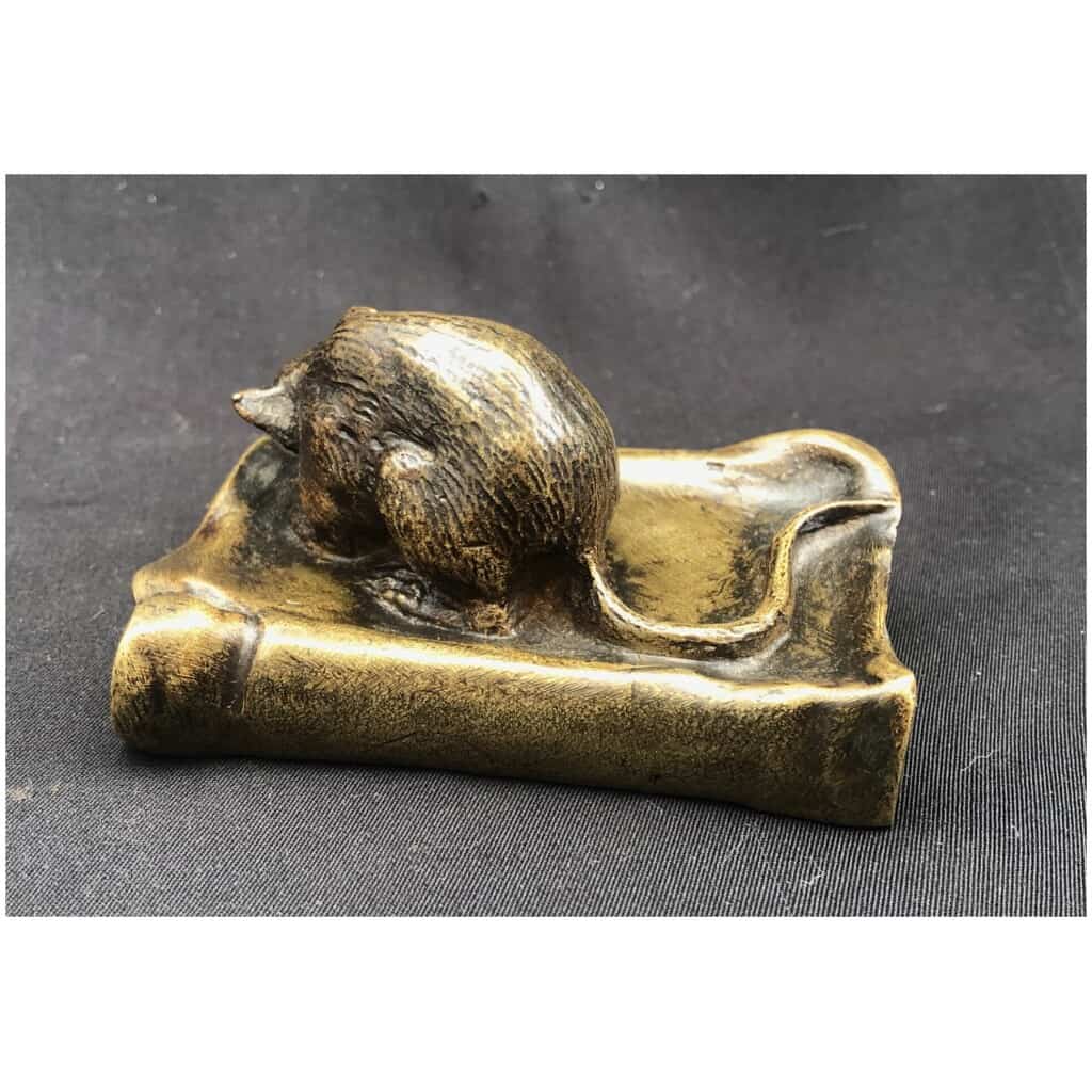 Bronze mouse munching on a book 5