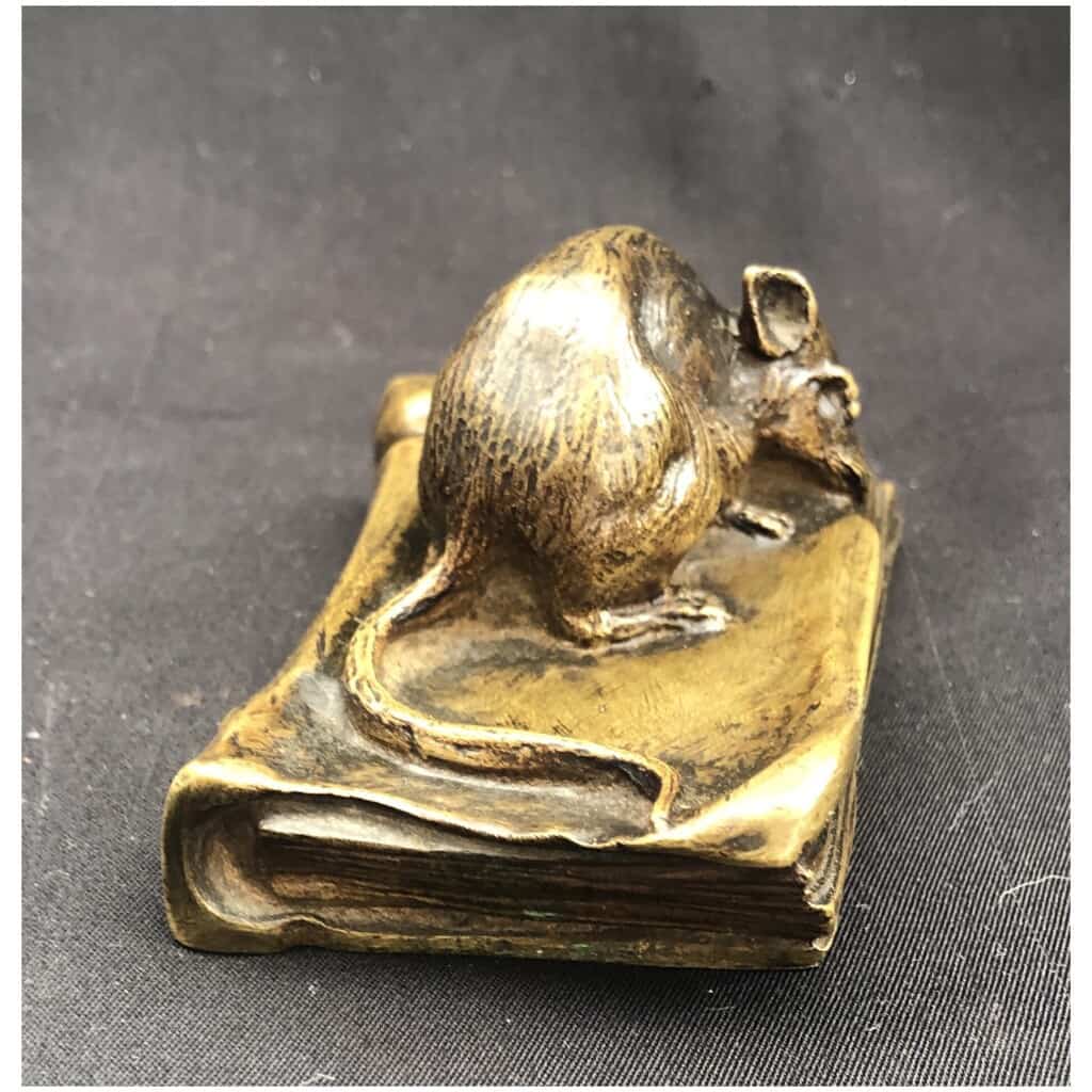 Bronze mouse munching on a book 6