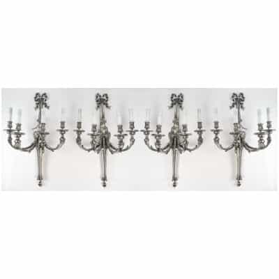 Suite de quatre appliques de style Louis XVI.
