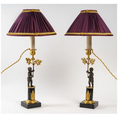Pair of candlesticks with Amour in patinated and gilded bronze, mounted as a lamp from the Directoire period