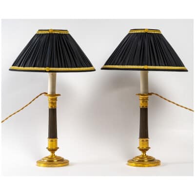 Paire de flambeaux montés en lampes à fûts cannelés en bronze doré époque Empire vers 1805-1810