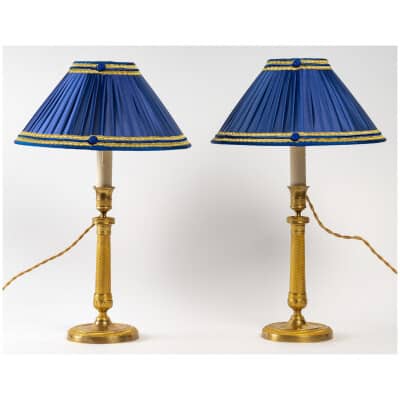 Paire de flambeaux montés en lampes en bronze doré époque Empire vers 1805-1810
