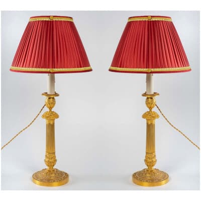 Pair of candlesticks mounted as lamps decorated with flowered baskets in gilt bronze Restoration period circa 1820-1830