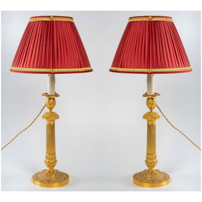 Paire de flambeaux montés en lampes à décor de panier fleuri en bronze doré époque Restauration vers 1820-1830