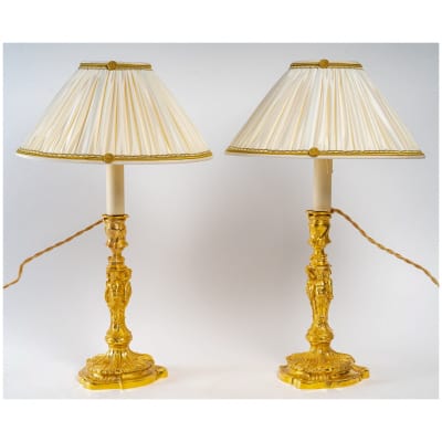 Pair of chiseled and gilt bronze cupid candlesticks in the Louis XV style circa 1850