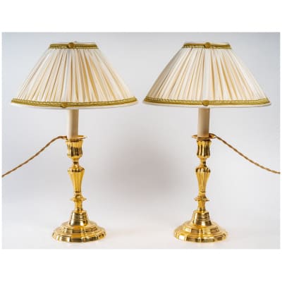 Paire de flambeaux XVIIIème siècle en bronze doré montés en lampes vers 1780