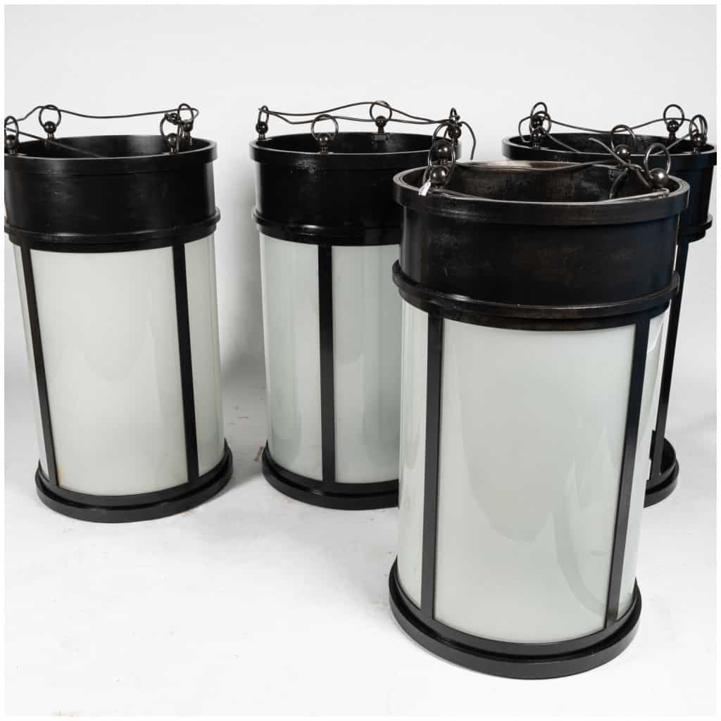 Series of 4 lanterns in cast iron and sandblasted glass, 3th century