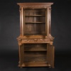 Buffet two bodies with the attributes of the war in carved walnut, XIXand 11