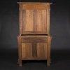 Buffet two bodies with the attributes of the war in carved walnut, XIXand 14