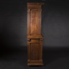 Buffet two bodies with the attributes of the war in carved walnut, XIXand 15