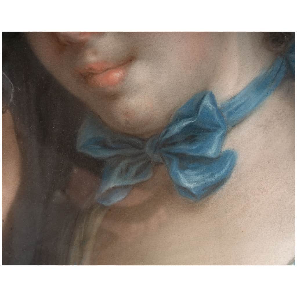 Portrait of a young woman with a blue ribbon. 6