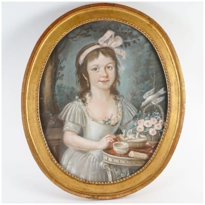 Portrait of a young girl with a pink ribbon.