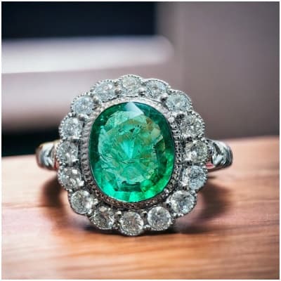 Ring In 18 Carat White Gold Set With Emerald Surrounded By Diamonds