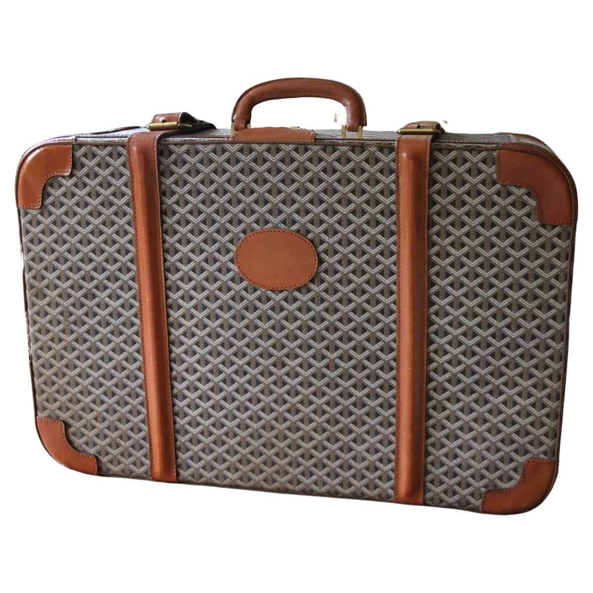 Rolling suitcase in goyardine and black leather, address…
