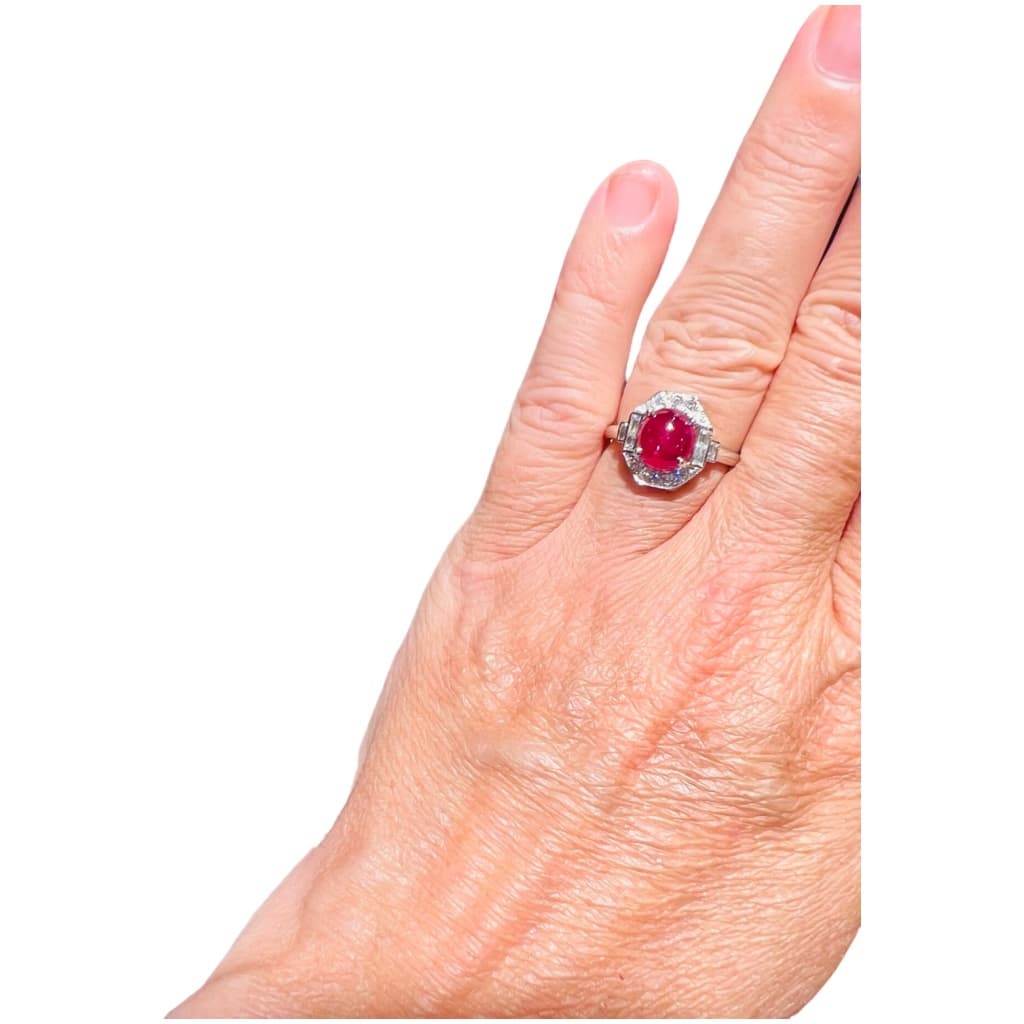 18 Carat Gold Ring Set With A Ruby Cabochon Surrounded By Diamonds 10