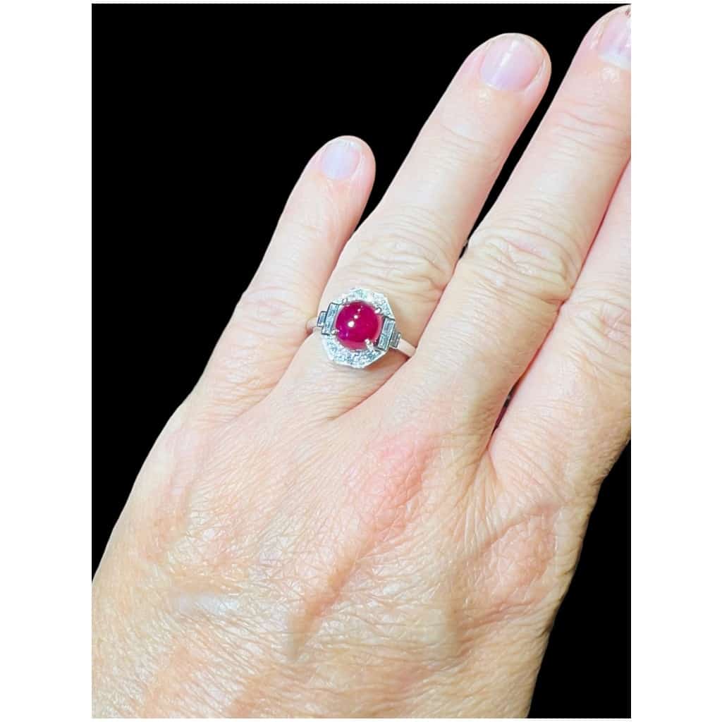 18 Carat Gold Ring Set With A Ruby Cabochon Surrounded By Diamonds 9