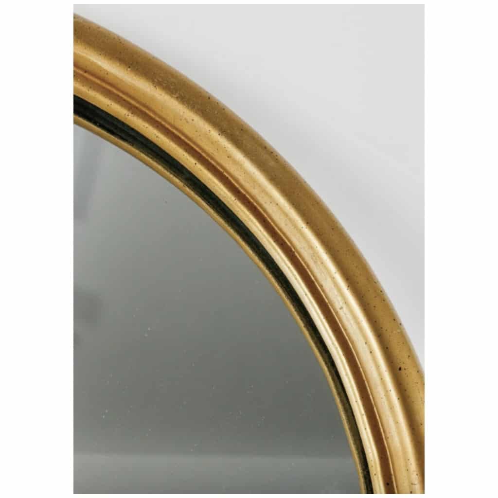 1960 Paire de miroirs en bois mouluré et doré inspirés d’une ogive romane. 5