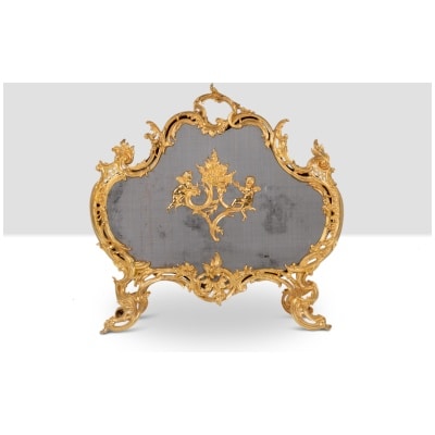 Louis XV style gilt bronze fire screen. Circa 1880.