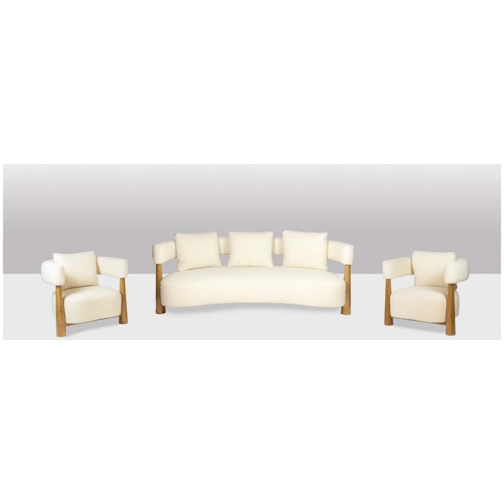 Pair of “bean” shaped armchairs, in blond beech. Contemporary work. 13