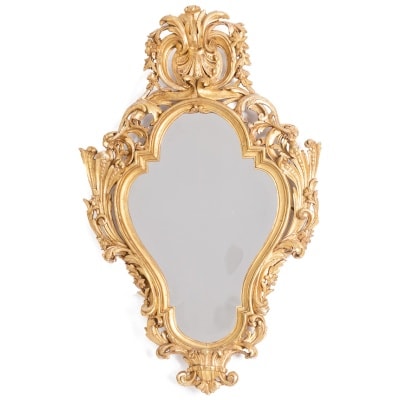 Regency style mirror in carved and gilded wood. 1950s.