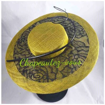 Mini olive green hat decorated with black lace