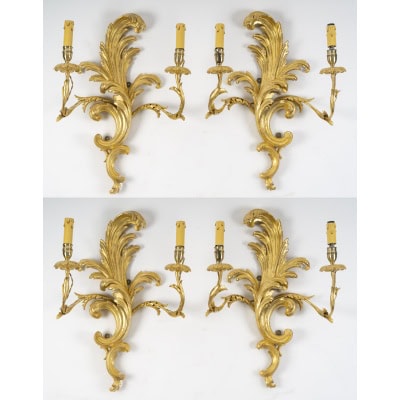 Suite de 4 appliques de style rocaille en bois sculpté et doré, circa 1900