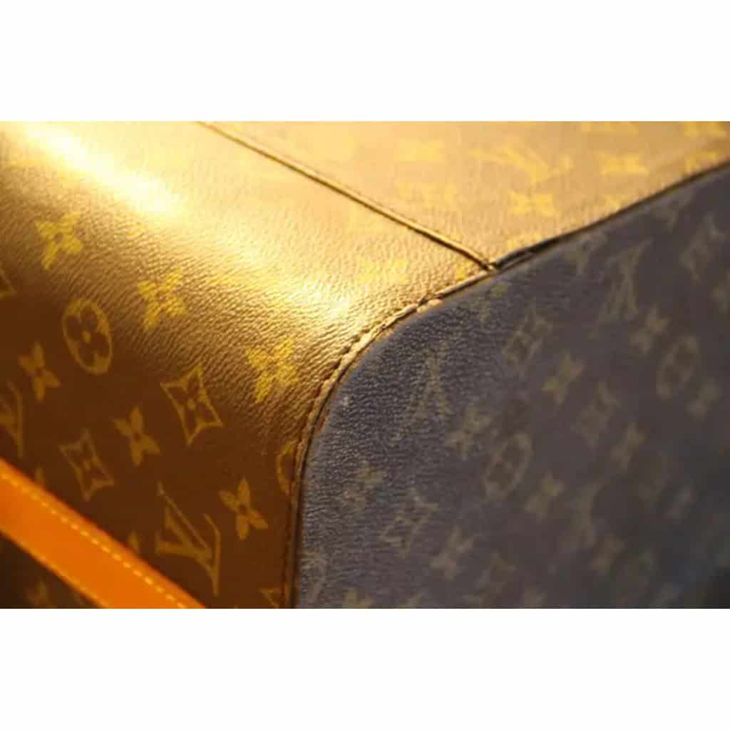 Vanity case Louis Vuitton à bandoulière. 12