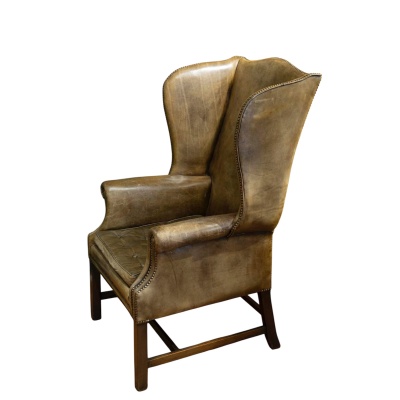Fauteuil anglais appelé « Wing Chair » en cuir vert. Circa 1920